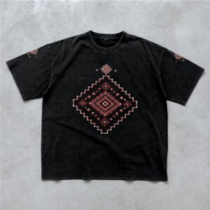Black acid wash oversized drop shoulder t-shirt featuring a red geometric Persian-inspired rug artwork on the front chest, with matching ornamental details on the sleeves and upper - DTF printe